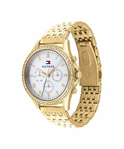 Reloj dorado con bisel de diamantes.